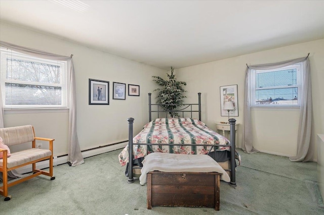 bedroom with light colored carpet and a baseboard radiator