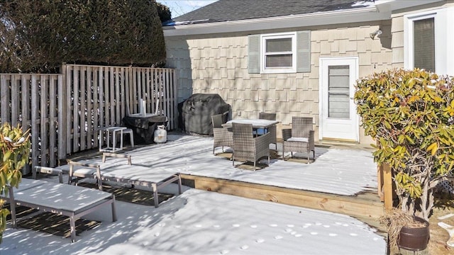 wooden terrace featuring grilling area