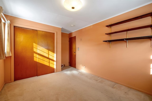 carpeted empty room featuring ornamental molding