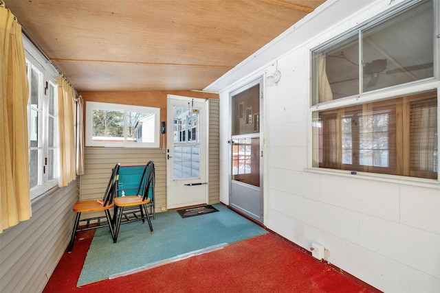 sunroom featuring wooden ceiling and lofted ceiling