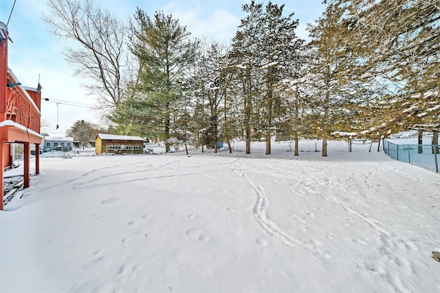 view of yard layered in snow