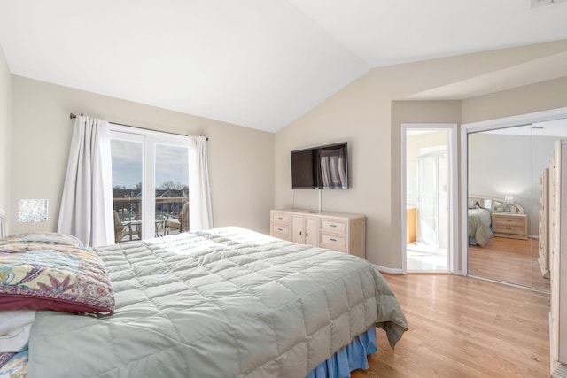 bedroom with lofted ceiling, access to exterior, light wood-type flooring, and a closet