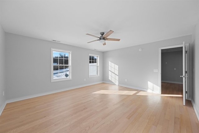 unfurnished room featuring ceiling fan and light wood-type flooring