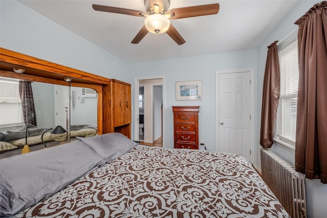 bedroom with radiator and ceiling fan