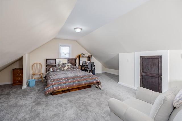 carpeted bedroom with vaulted ceiling