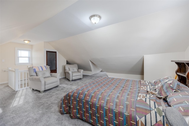 bedroom featuring carpet floors and lofted ceiling