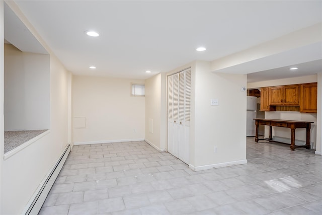 interior space featuring refrigerator and a baseboard radiator