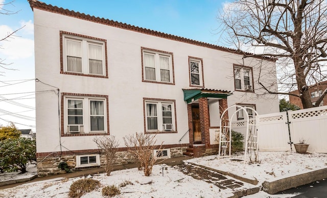 mediterranean / spanish-style home featuring cooling unit