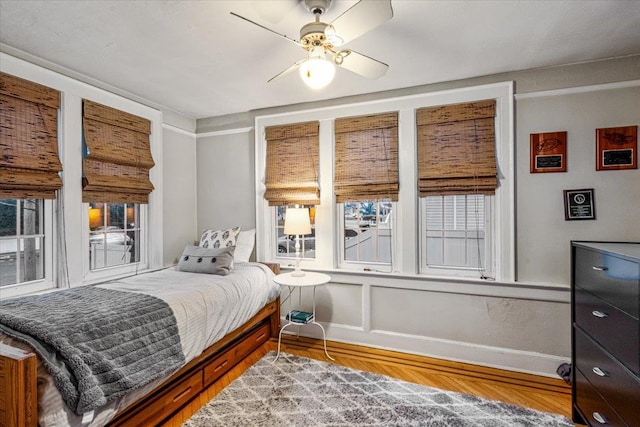 bedroom featuring ceiling fan and wood-type flooring