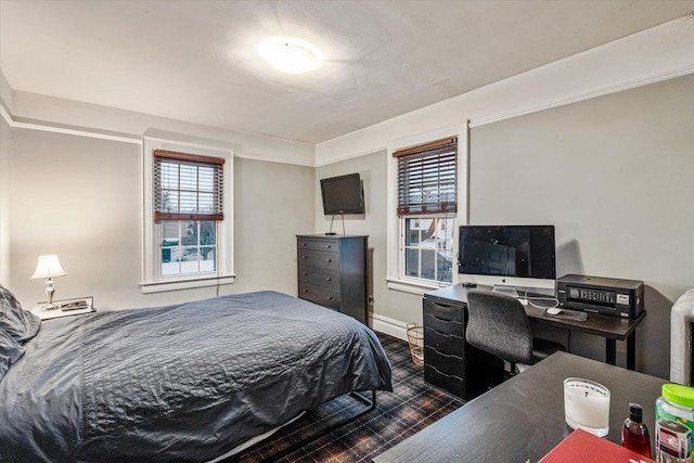 bedroom with dark wood-type flooring