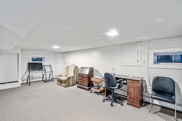 carpeted office featuring a baseboard radiator and electric panel