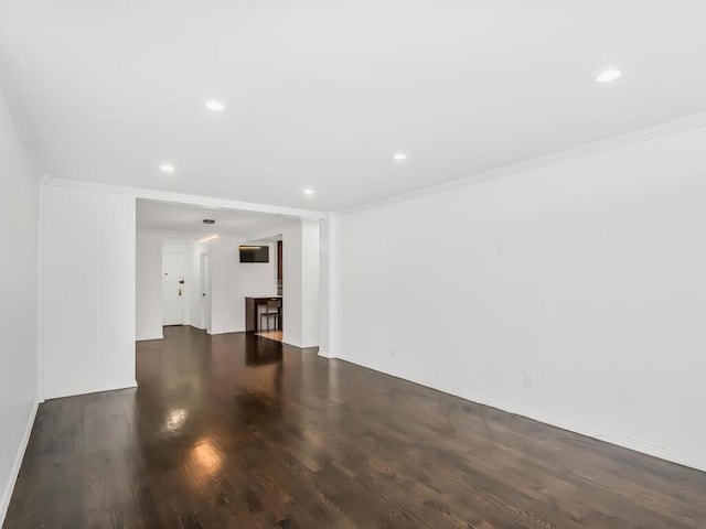 interior space featuring dark hardwood / wood-style flooring and crown molding