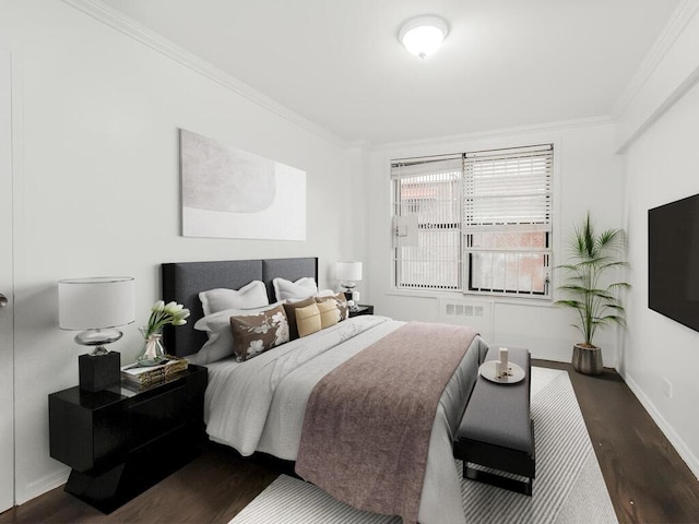 bedroom featuring dark hardwood / wood-style flooring and crown molding