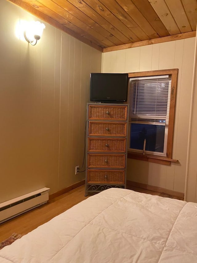1139 State Route 17b, Mongaup Valley, NY 12762 - bedroom with wood ceiling, baseboard heating, and wood finished floors