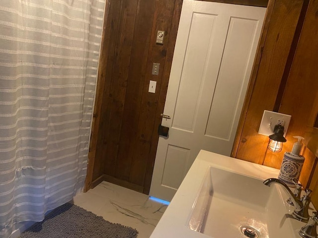 1139 State Route 17b, Mongaup Valley, NY 12762 - bathroom featuring marble look tile flooring, a shower with curtain, and wooden walls