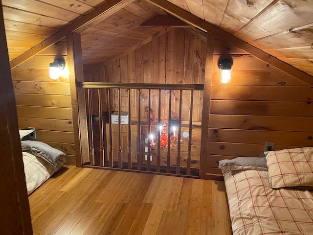 1139 State Route 17b, Mongaup Valley, NY 12762 - bedroom featuring wooden walls, wood-type flooring, vaulted ceiling, and wooden ceiling