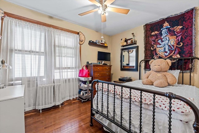 bedroom featuring wood-type flooring and ceiling fan