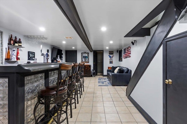 bar with light tile patterned floors