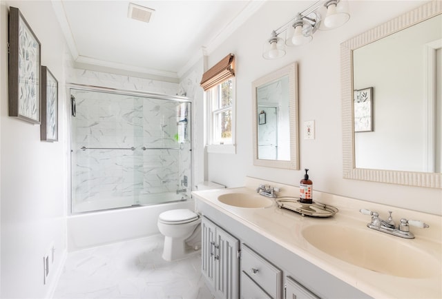 full bathroom featuring bath / shower combo with glass door, vanity, crown molding, and toilet