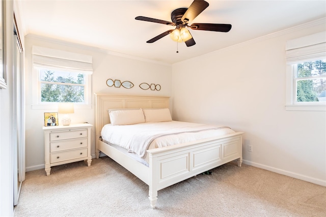 bedroom with light carpet, ornamental molding, and ceiling fan