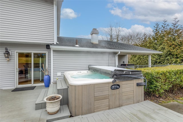 deck featuring a hot tub