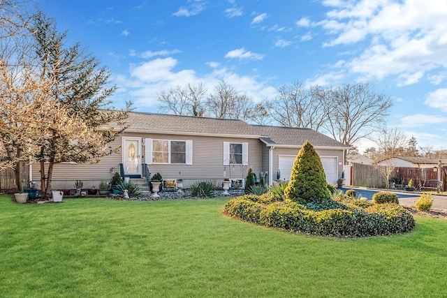 view of front of house with a front lawn and a garage