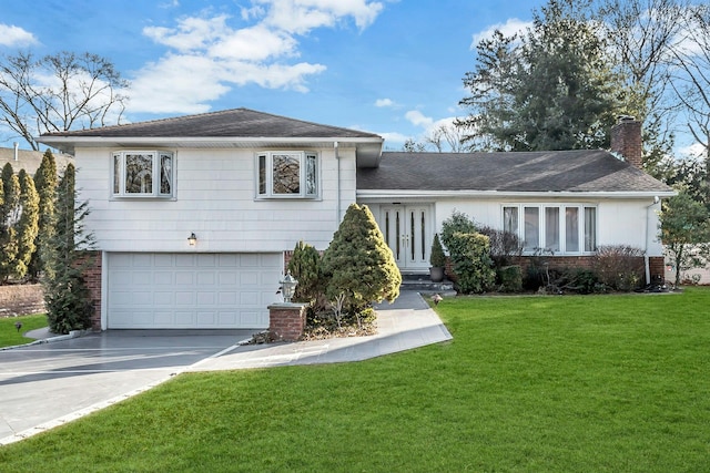 view of front of home with a garage and a front yard