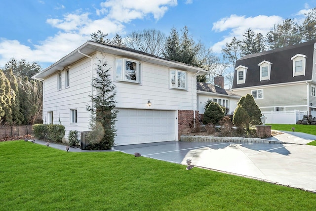 view of front of property with a front lawn and a garage