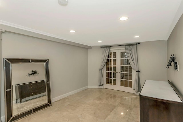 interior space featuring crown molding and french doors