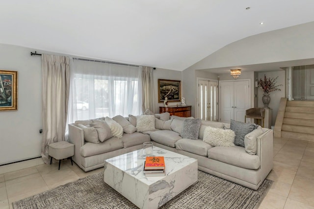 living room with light tile patterned floors and vaulted ceiling