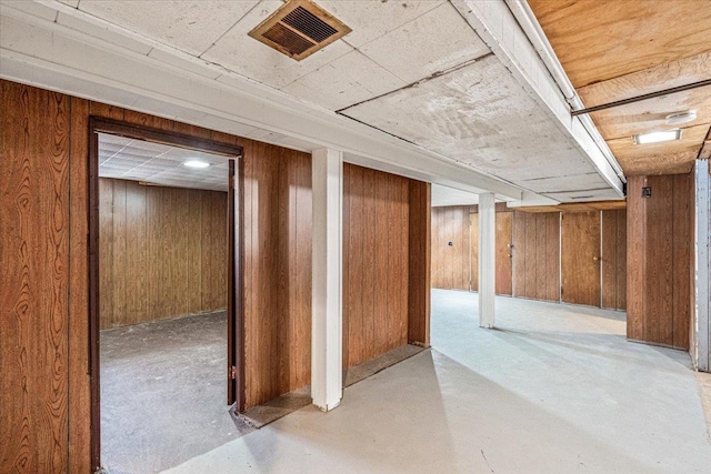 interior space featuring wooden walls