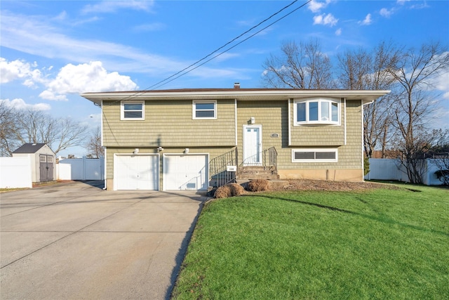 bi-level home with a front lawn and a garage