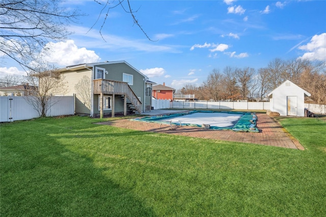 view of pool with a yard and a storage shed