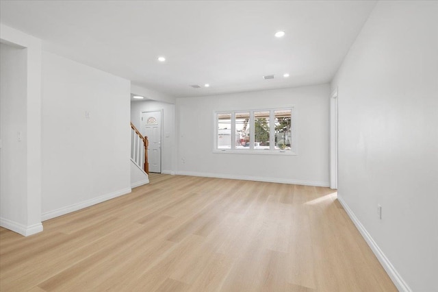 unfurnished room featuring light hardwood / wood-style floors