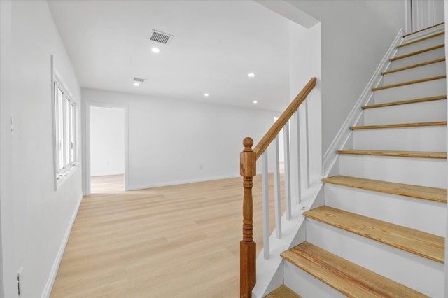 stairway featuring hardwood / wood-style flooring