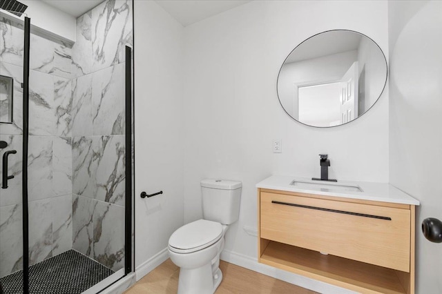 bathroom with vanity, an enclosed shower, wood-type flooring, and toilet