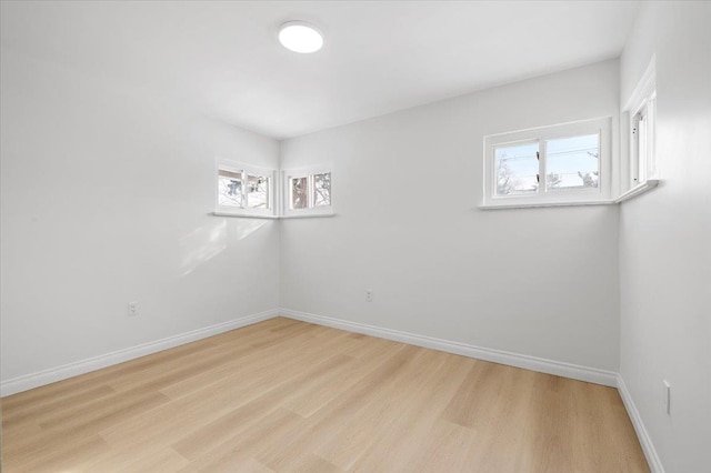 unfurnished room with light hardwood / wood-style floors