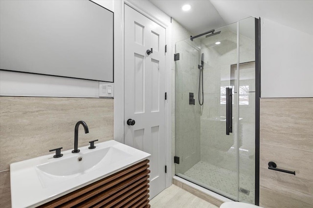 bathroom with vanity and an enclosed shower