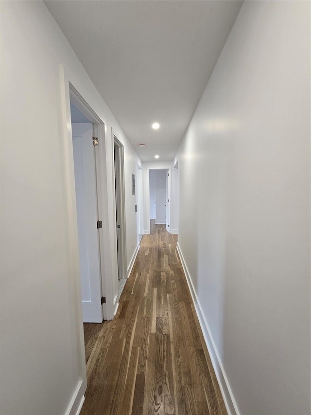 corridor with dark hardwood / wood-style floors