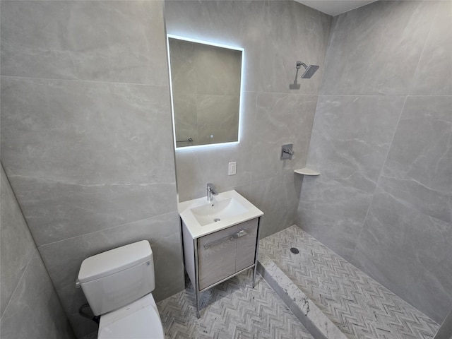 bathroom with a shower, toilet, and vanity