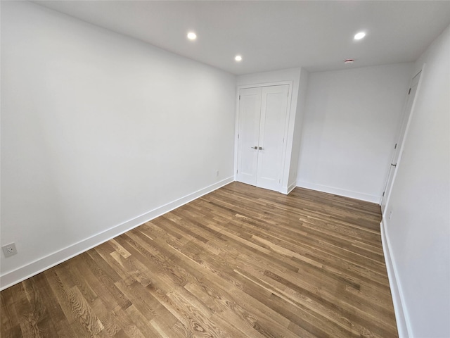 unfurnished bedroom featuring wood-type flooring