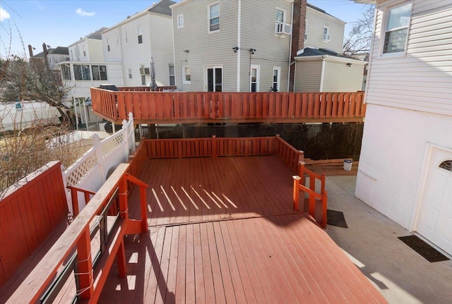 wooden terrace with a residential view