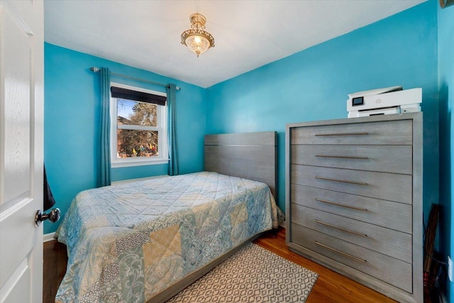 bedroom featuring wood finished floors