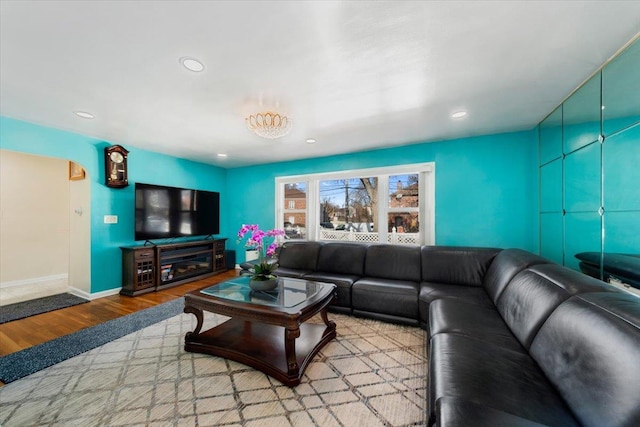 living room with recessed lighting, wood finished floors, and baseboards