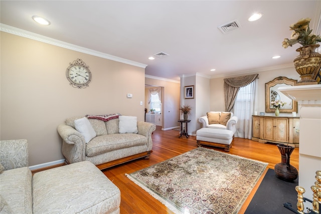 living room with ornamental molding and wood-type flooring