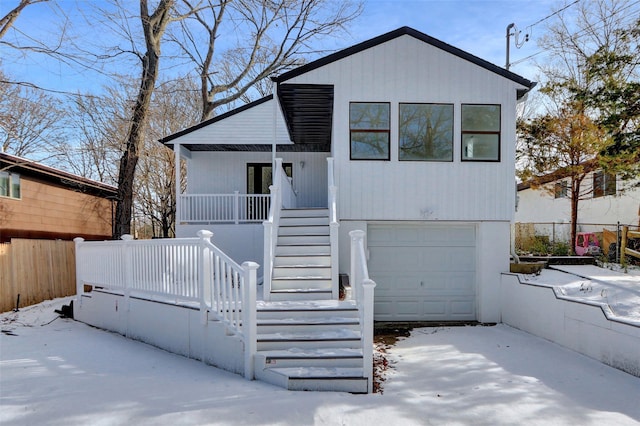 view of front facade with a garage and a porch