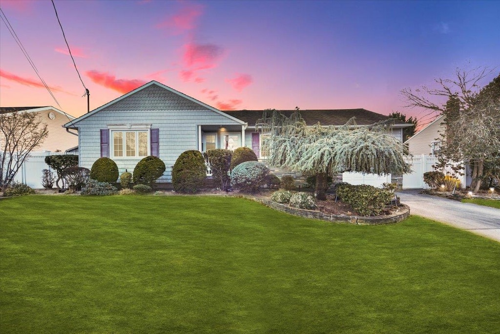 view of front of home with a lawn