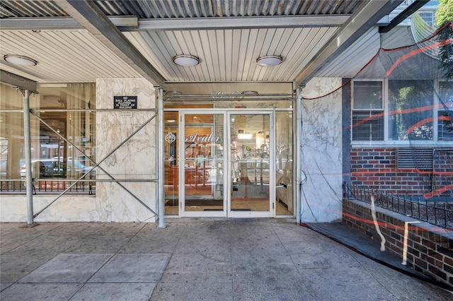 view of exterior entry featuring french doors