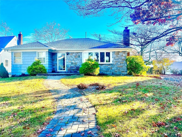 ranch-style home with a front yard