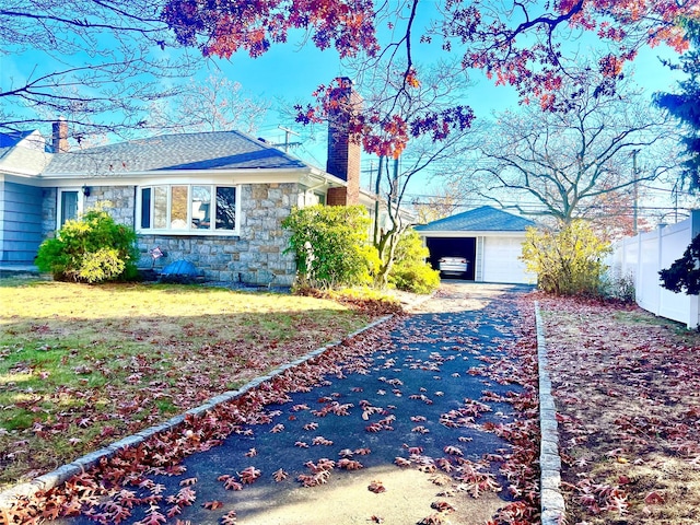 view of home's exterior featuring an outbuilding and a garage